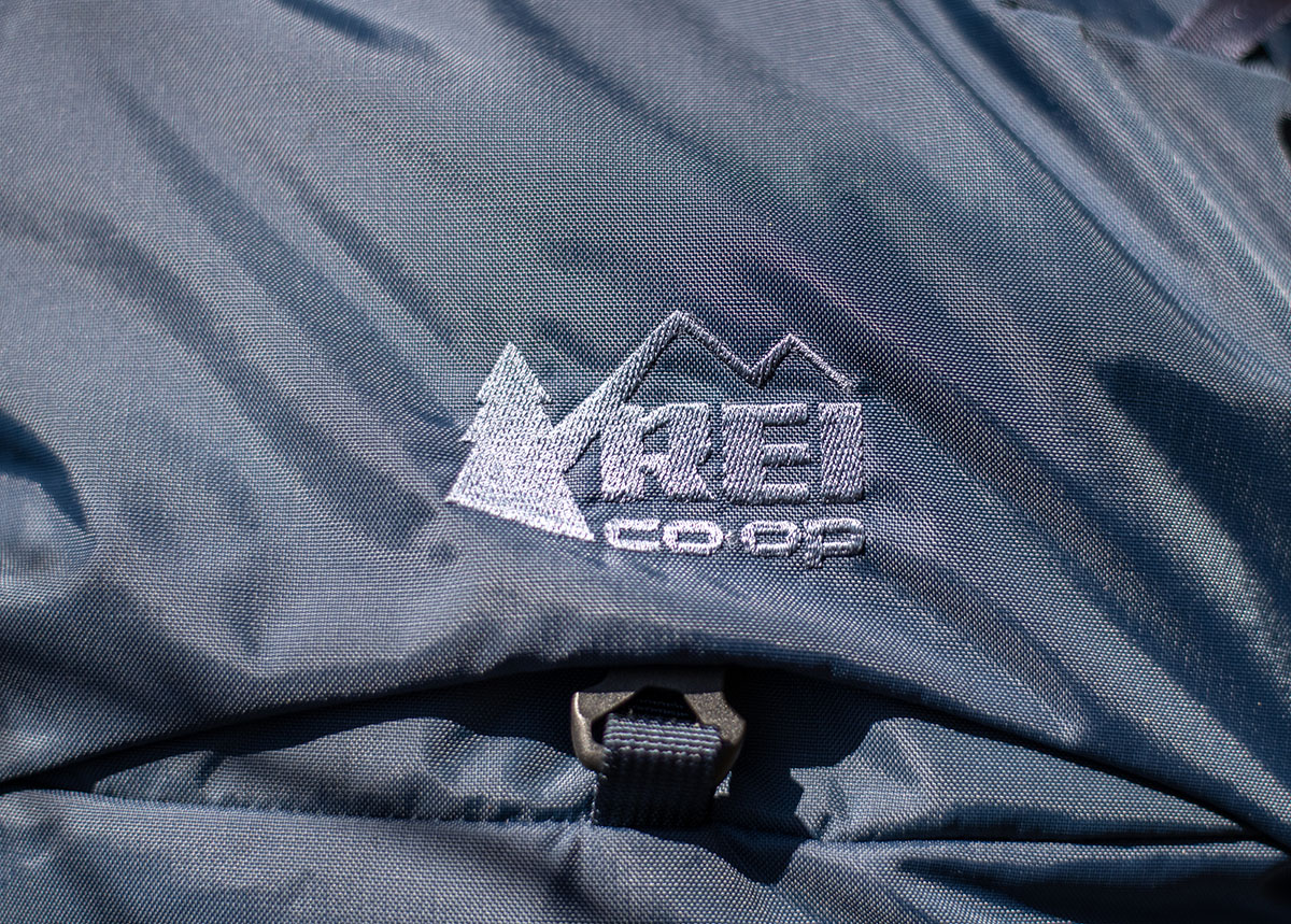 REI Co-op Traverse 60 backpack (logo closeup)
